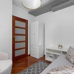 Grey And Pink Two Bedroom In Cracow With Parking, Desk, Terrace And Jacuzzi Bathtub By Renters Apartment Krakow